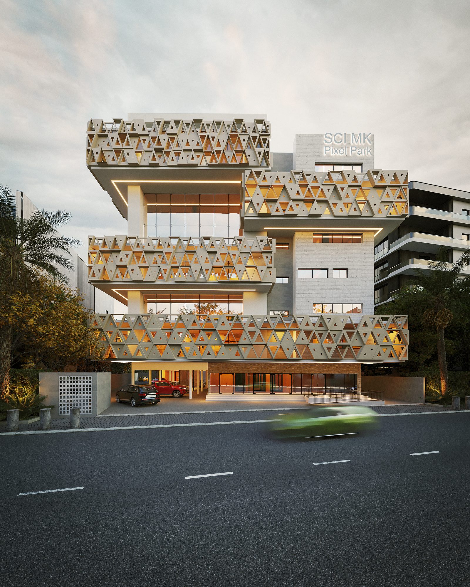 Complexe immobilier à Abidjan — vue de la façade habillée de modules triangulaires ajourés, depuis la rue